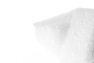 Light background with sugar cubes at high magnification.