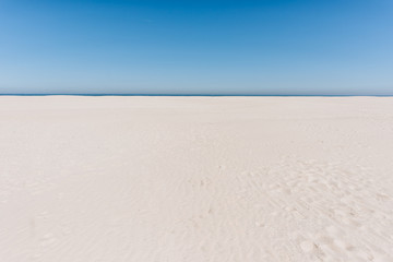 Wide sand beach landscape, sunny day, blue sky, Juist, Germany
