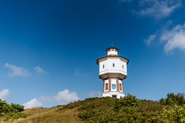 Fototapeta na wymiar Water tower of the island Langeoog, Germany, sunny day, blue sky
