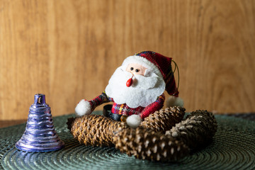 Santa Claus amid pine cones and Christmas motifs