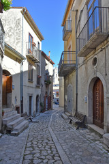 A narrow street between the old houses of Castelvetere sul Calore, village in the province of Avellino, Italy