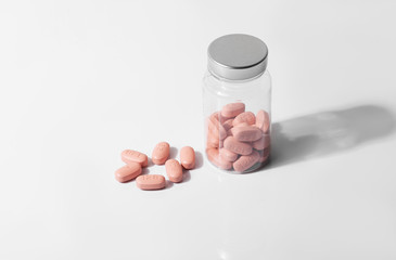 HIV/AIDS therapy pills on white background.