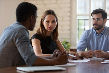 Negotiations process in boardroom between business parties concept. Diverse businesspeople gathered...