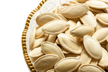 fresh pumpkin seeds in glass dish