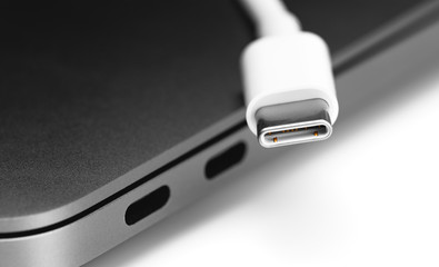 USB Type-C cable with notebook USB C ports closeup