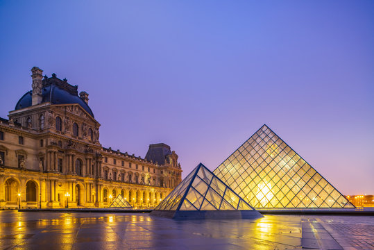 View of famous Louvre Museum with Louvre Pyramid