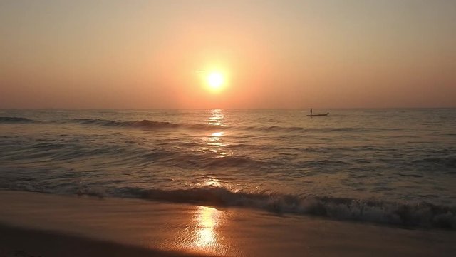Indian Fishermen in the sea at sunrise fishing in middle of sea. Fishing in middle of sea. Men fishing on boat in ocean. Fishing men in morning sunrise..The sun over sea. Amazing red sunrise on beach 