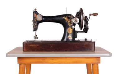 Antique, vintage sewing machine on an old table