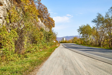 Beautiful landscape with empty road in the mountains in summer or autumn day
