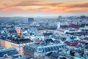 Obraz premium Austria, Vienna - View from the main cathedral of St. Stephen to the city, twilight. Evening view of the city of Vienna, the lights of the night city.