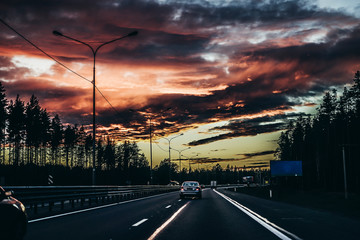 beautiful sunset and road in the evening red sky with clouds