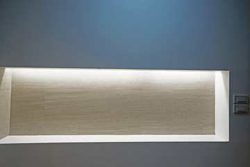 White recessed wall shelf with lighting