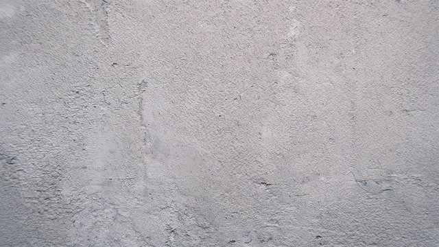 Wall with old stucco closeup as background