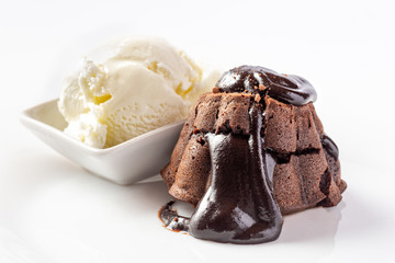Chocolate fondant melt with  ice cream on white plate
