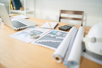 Architectural plans Laptop, calculator pencil pen and ruler on the table, Concept architects,...