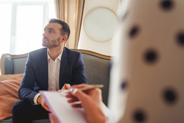 Frustrated man with a short haircut looking away