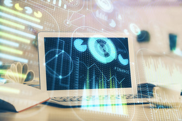 Double exposure of desktop computer and technology theme hologram. Concept of software development.