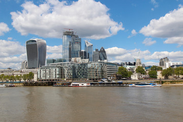 Fototapeta premium Financial District of London with the blue sky and clouds on a bright sunny day in spring, London, UK