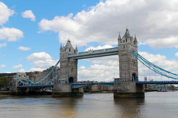 Fototapeta na wymiar Tower Bridge with the blue sky and clouds on a bright sunny day in spring, London, UK
