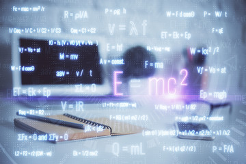 Desktop computer background and formula hologram writing. Double exposure. Education concept.