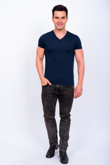 Obraz premium Full body shot of happy young handsome man smiling