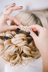 Fototapeta premium stylist creates the image of the bride