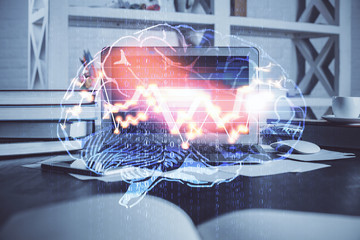 Double exposure of work table with computer and brain sketch hologram. Brainstorming concept.