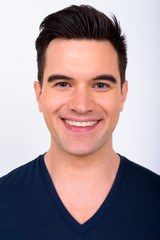 Obraz premium Face of happy young handsome man smiling