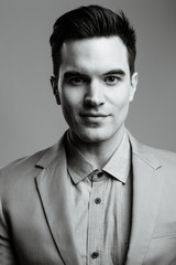 Young handsome businessman in black and white