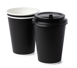 Paper coffee cups isolated on white background. Close up.