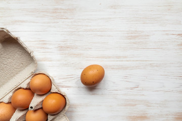 Free-range organic brown eggs in recycled cardboard box