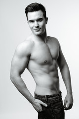 Fototapeta premium Young handsome man shirtless in black and white