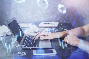 Double exposure of forex chart with man working on computer on background. Concept of market analysis.