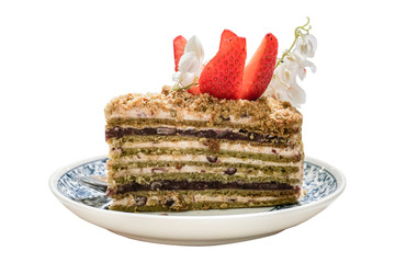 Medovik cake. Russian honey cake. Medovik decorated with strawberry. Closeup view..