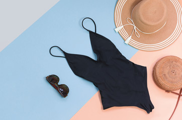 Swimming suit with sunglasses and straw hat for summer. Flatlay