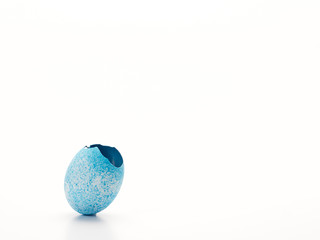 Easter egg cracked open on white.