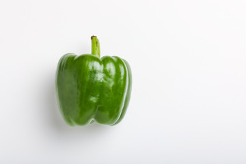 fresh green bell pepper (capsicum) on a white background