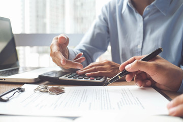 Business Insurance authorities showing an insurance policy and dealing the policyholder must to...