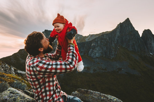 Father Holding Up Baby Happy Family Travel Vacations Hiking In Mountains Man With Child Together Outdoor Summer Camping Healthy Lifestyle