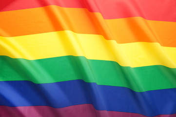 A rainbow flag background with copy space