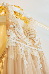 wedding dress closeup, white and gold color