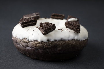 chocolate donut in white glaze closeup