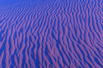 Sand in the dunes by the waves