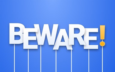 White Beware text on blue background. Letters on sticks, photobooth props. Awareness phrase during covid 19 quarantine.