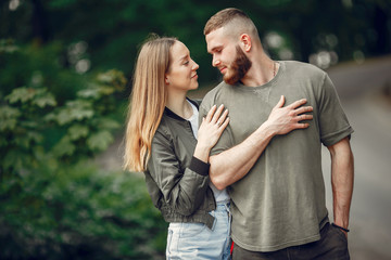 Couple in a forest. Man in a green t-shirt