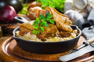 Traditional spare ribs baked in sauerkraut.