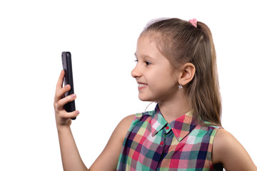 Cute little girl using mobile phone on white background.