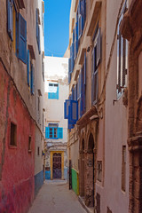 View of the narrow city street Essaouira, Morocco. Vertical.
