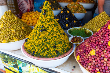 Pickled olives on a traditional Moroccan market in Essaouira, Morocco. With selective focus.