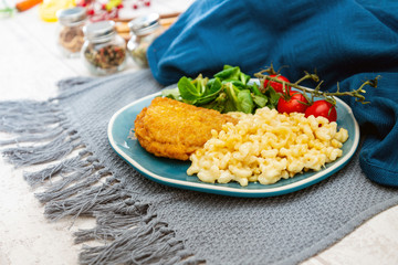 Italian food macaroni gratin with ham on table